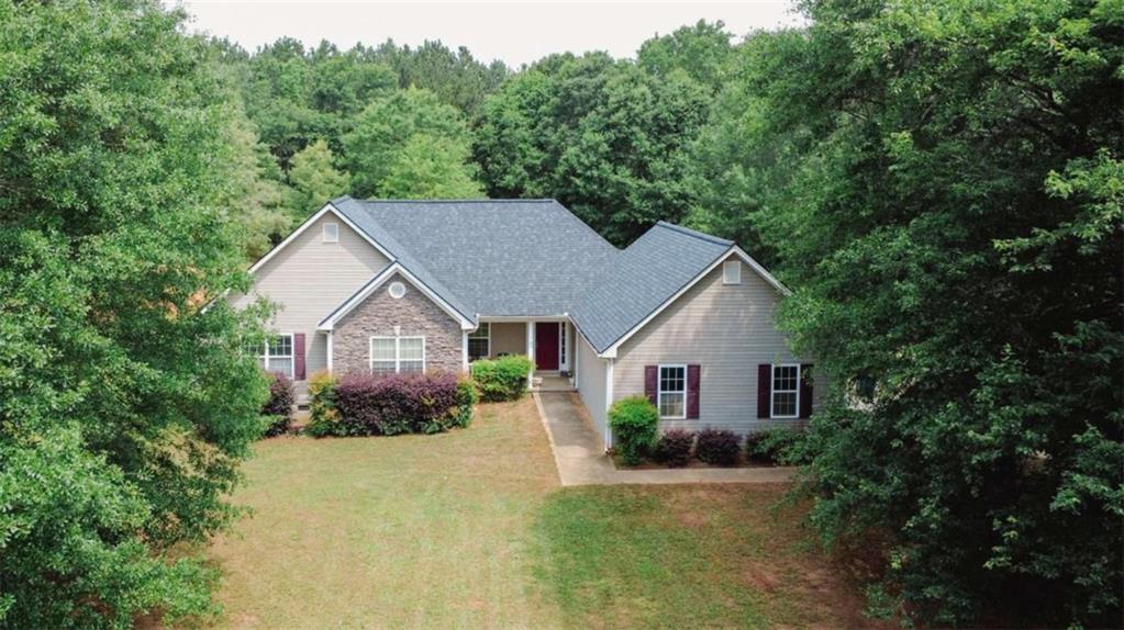 940 Sandy Ford Road Social Circle, GA 30025 - Photo 1 of 1 a front view of a house with a yard and garage