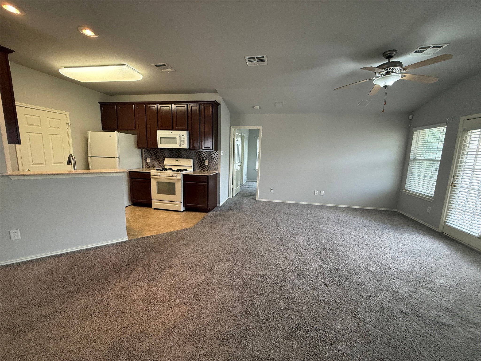 1900 Scofield Ridge Parkway, Unit 4701 Austin, TX 78727 - Photo 10 of 27 An open layout connects the kitchen to the living area, creating an inviting space for daily living.