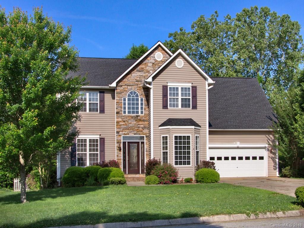 218 Walnut Crest Road, Unit 258 Fletcher, NC 28732 - Photo 1 of 24 a front view of a house with a yard and trees