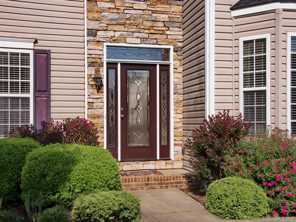 218 Walnut Crest Road, Unit 258 Fletcher, NC 28732 - Photo 2 of 24 a front view of a house with plants