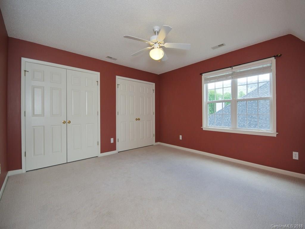 218 Walnut Crest Road, Unit 258 Fletcher, NC 28732 - Photo 20 of 24 a view of an empty room with window and chandelier fan