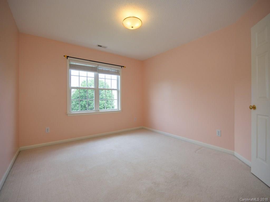 218 Walnut Crest Road, Unit 258 Fletcher, NC 28732 - Photo 21 of 24 an empty room with a window