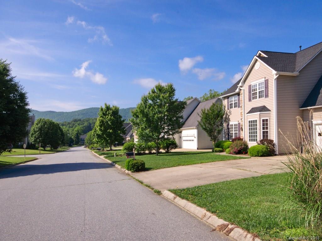 218 Walnut Crest Road, Unit 258 Fletcher, NC 28732 - Photo 24 of 24 a front view of a house with a yard and garage