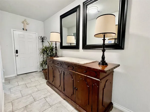 a view of a sink and mirror in a room