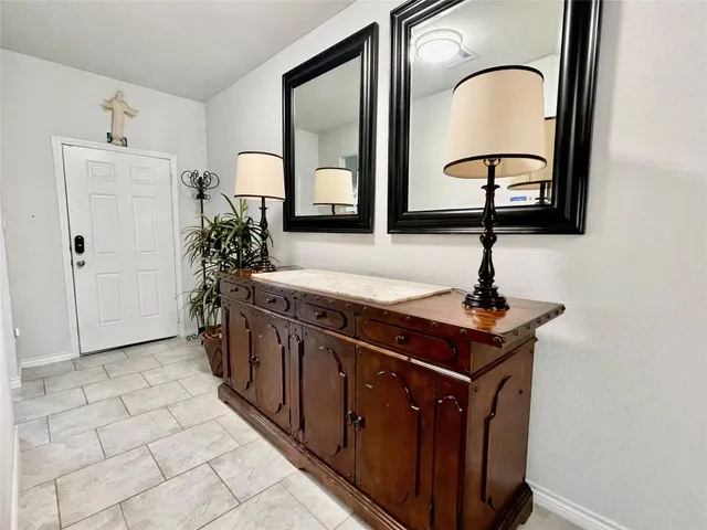a view of a sink and mirror in a room