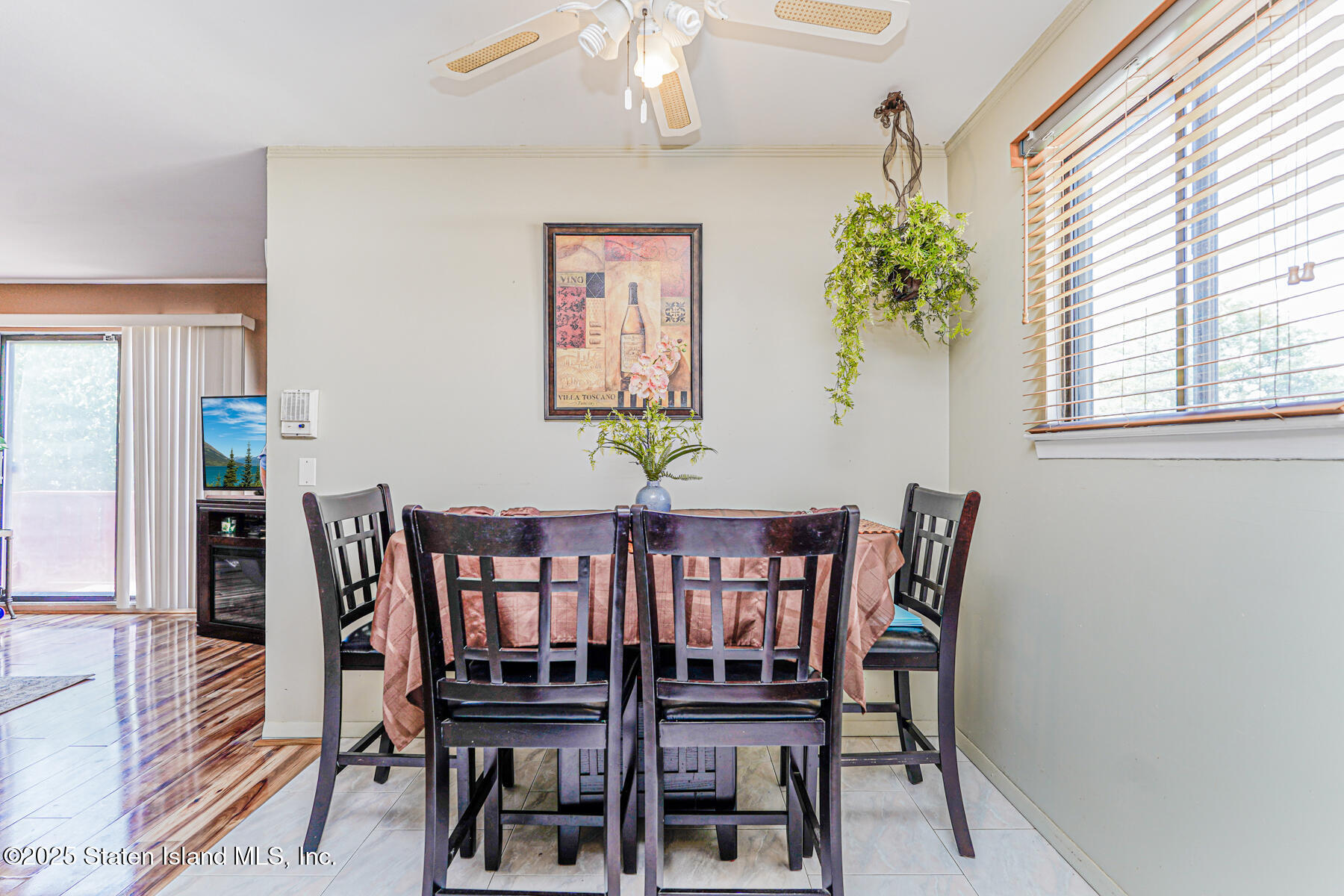 101 Stack Drive, Unit A Staten Island, NY 10312 - Photo 11 of 22 a view of a dining room with furniture and a chandelier