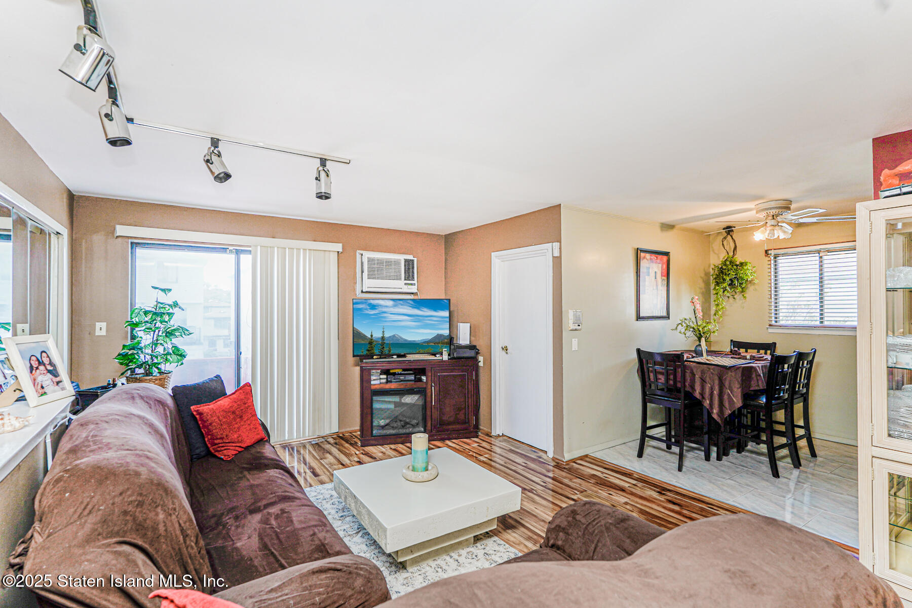 101 Stack Drive, Unit A Staten Island, NY 10312 - Photo 14 of 22 a living room with furniture and a dining table