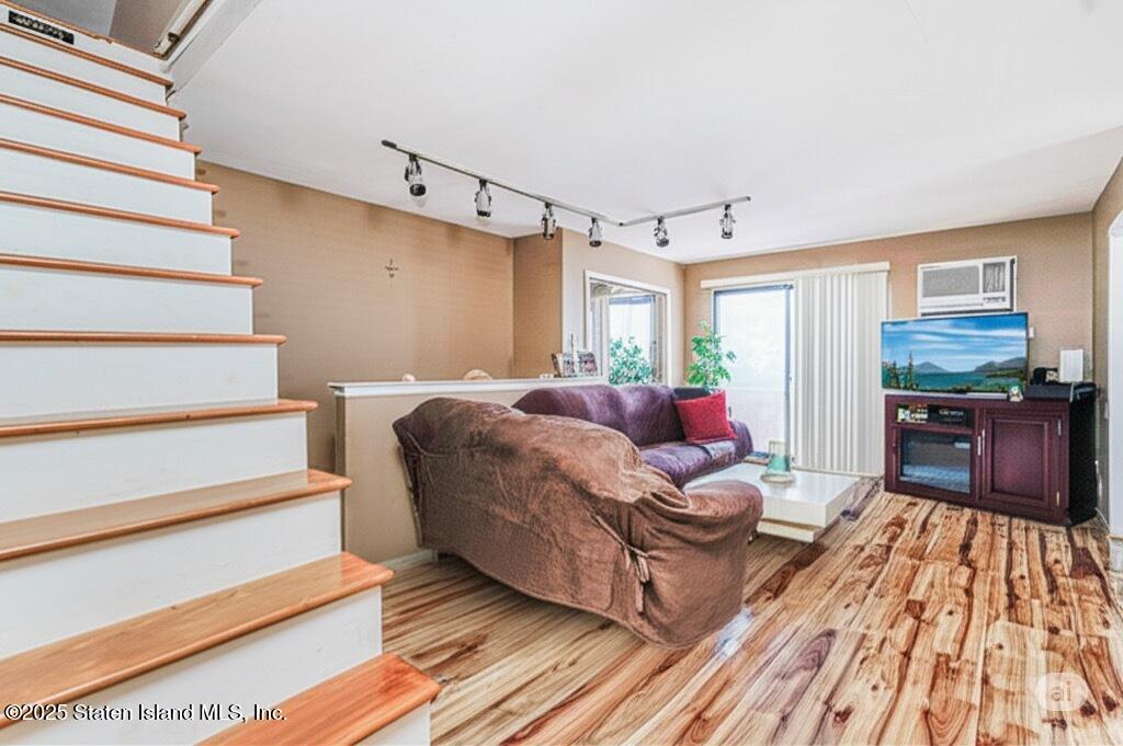 101 Stack Drive, Unit A Staten Island, NY 10312 - Photo 15 of 22 a living room with furniture and wooden floor