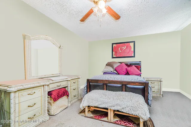 a bedroom with furniture and a bed