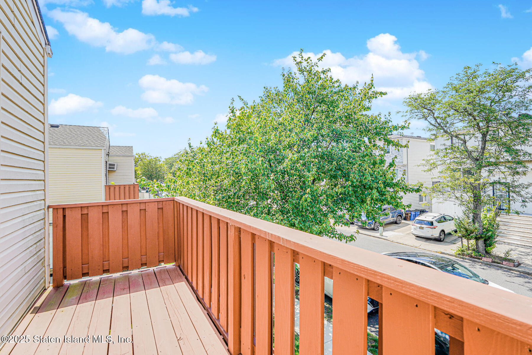 101 Stack Drive, Unit A Staten Island, NY 10312 - Photo 21 of 22 a balcony with wooden floor in front of it