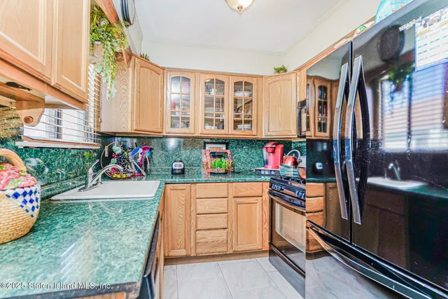 a kitchen with a refrigerator and window