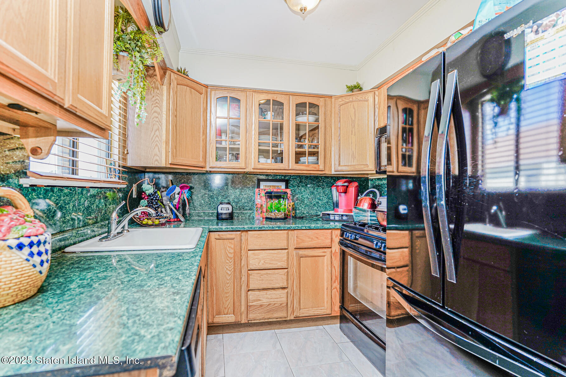 101 Stack Drive, Unit A Staten Island, NY 10312 - Photo 8 of 22 a kitchen with a refrigerator and window