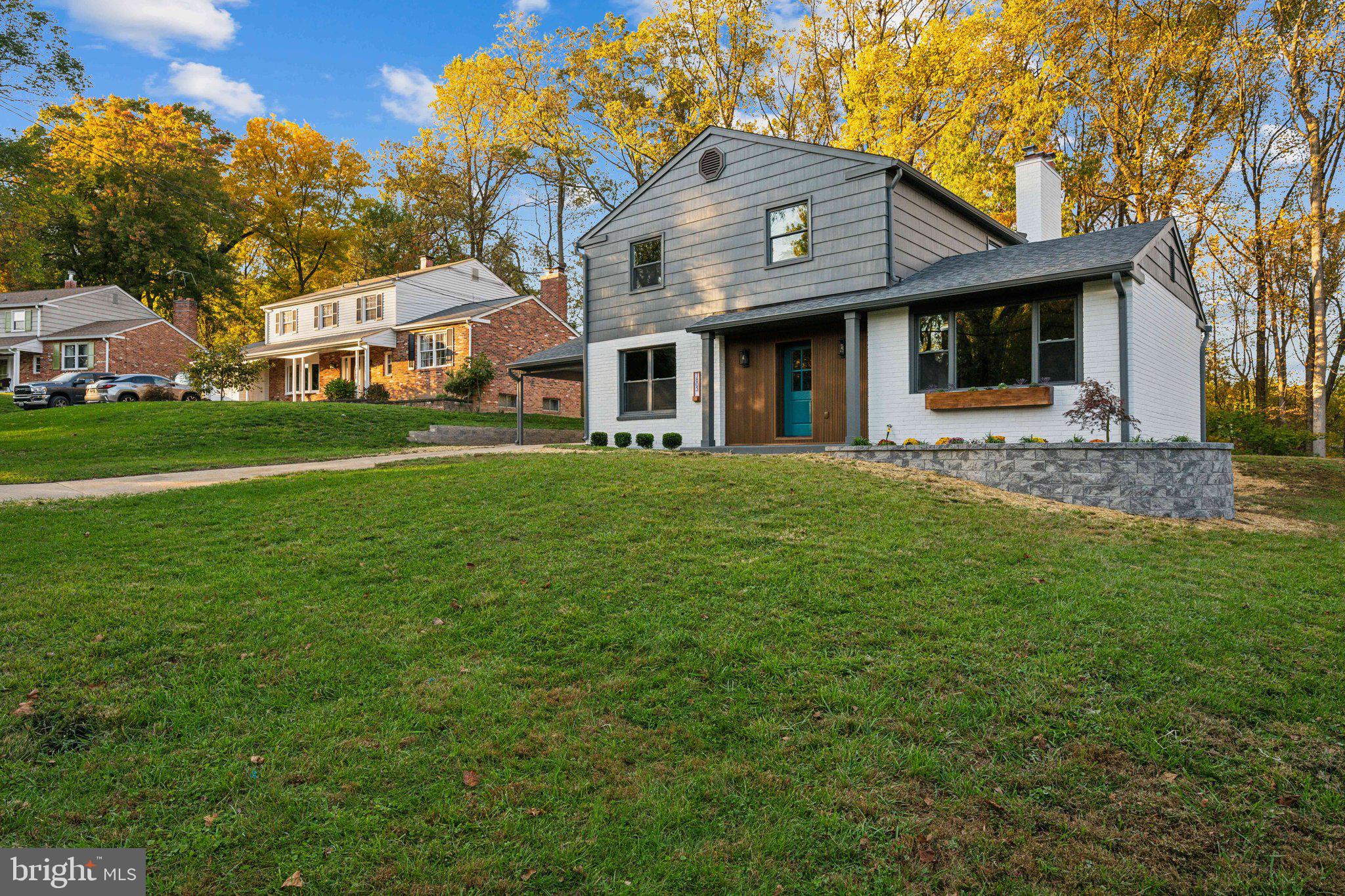 1803 Snowdrop Lane Silver Spring, MD 20906 - Photo 2 of 41 a front view of a house with a garden