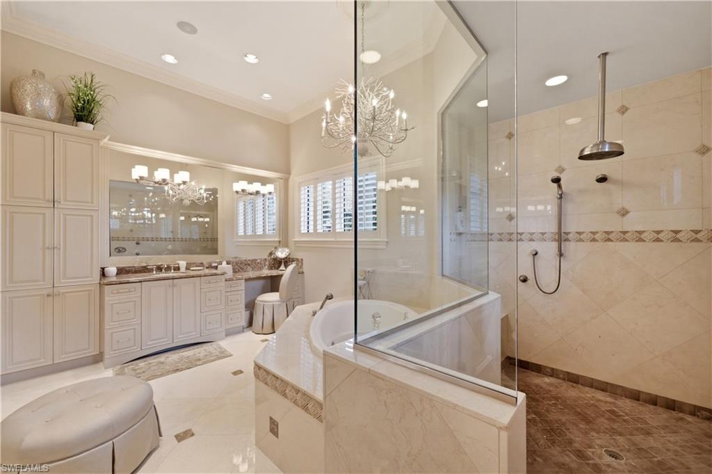 361 Pirates Bight Naples, FL 34103 - Photo 22 of 45 a room with white cabinets and stainless steel appliances