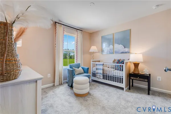 a bedroom with furniture and a window