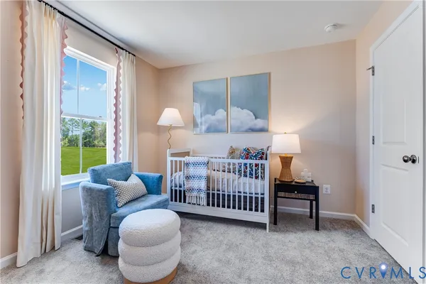 a bedroom with furniture and a window