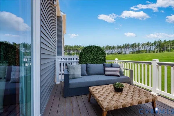 a terrace view with seating space and a garden