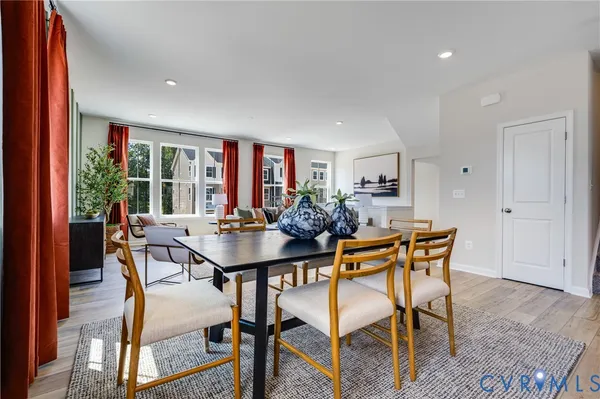 a view of a dining room with furniture and window