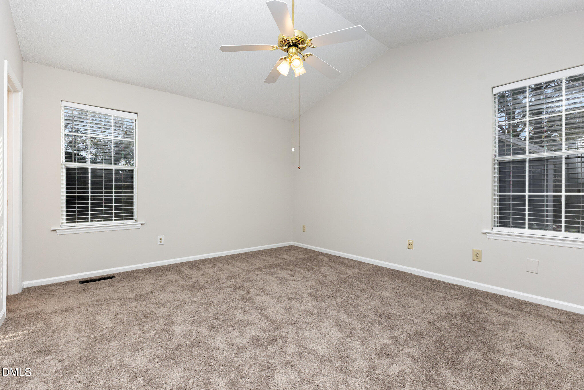 2108 Carthage Circle Raleigh, NC 27604 - Photo 20 of 27 an empty room with windows and fan