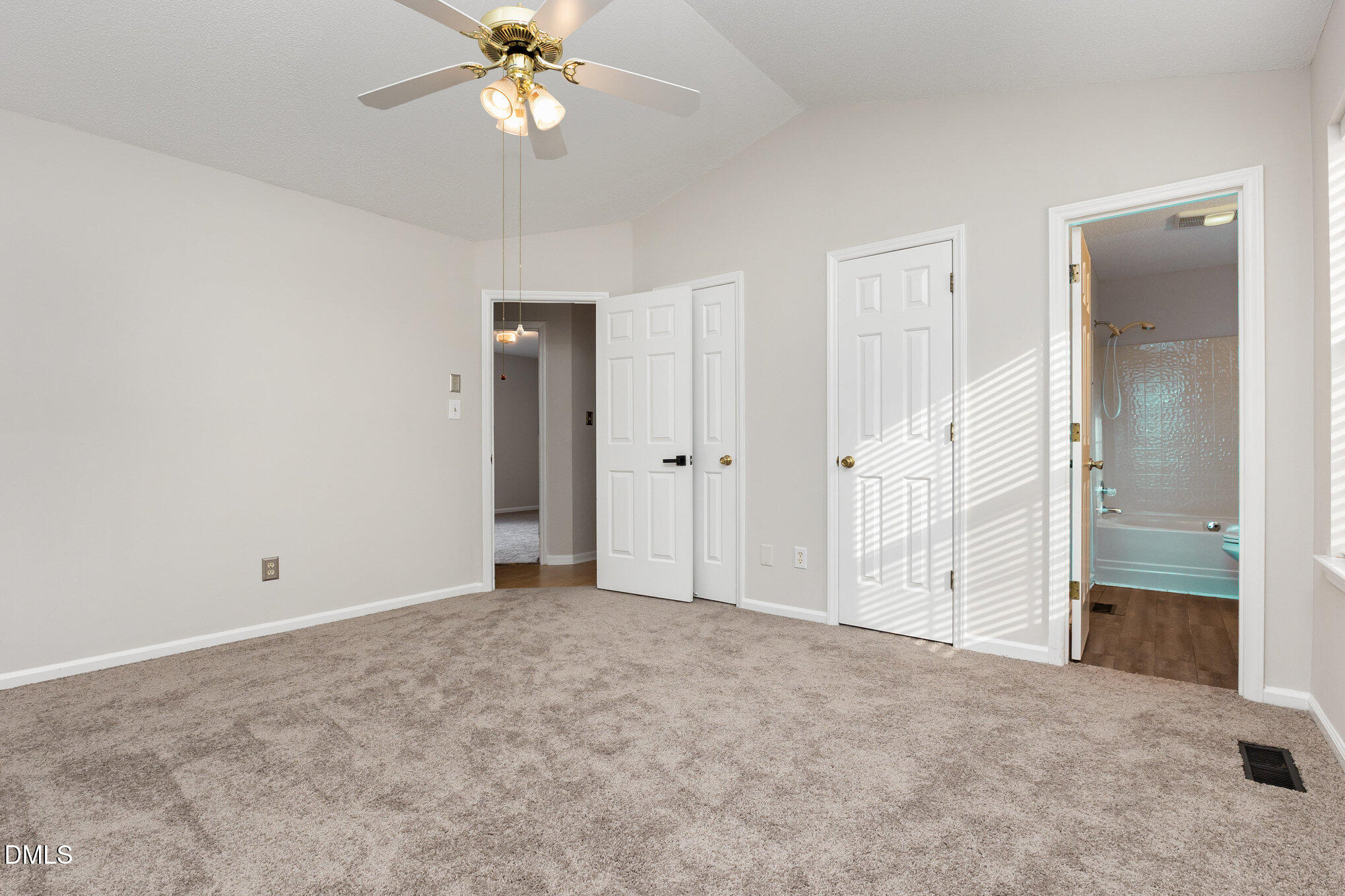 2108 Carthage Circle Raleigh, NC 27604 - Photo 21 of 27 an empty room with fan and entrance