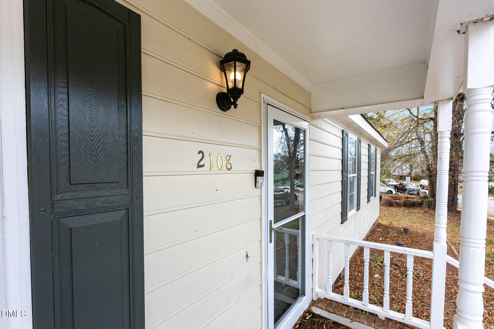 2108 Carthage Circle Raleigh, NC 27604 - Photo 4 of 27 a view of a hallway with wooden floor and windows