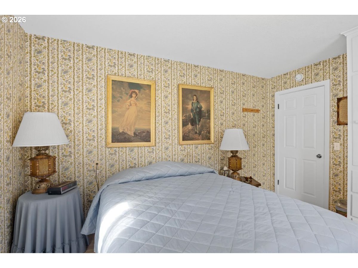 2277 Cougar Creek Road Oakland, OR 97462 - Photo 15 of 34 a bed room with a bed and a window