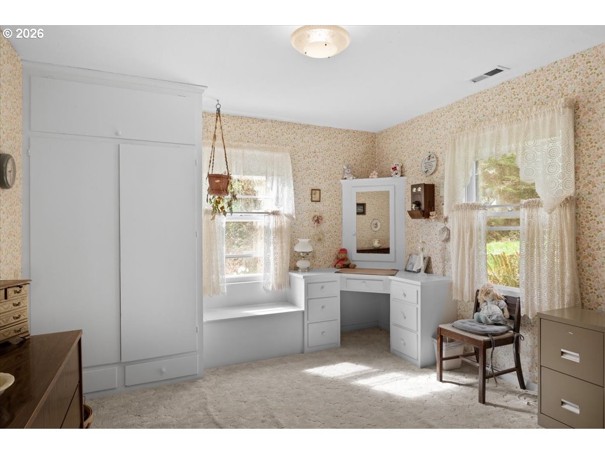 2277 Cougar Creek Road Oakland, OR 97462 - Photo 18 of 34 a living room with stainless steel appliances kitchen island granite countertop furniture and a fireplace