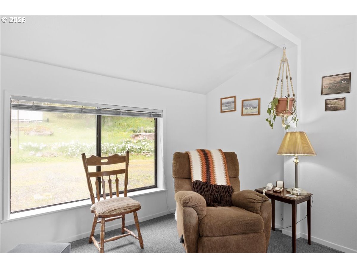 2277 Cougar Creek Road Oakland, OR 97462 - Photo 20 of 34 a living room with furniture and a window