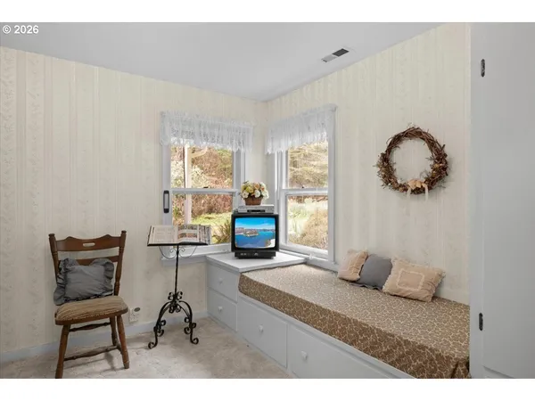 a open area with shower curtain