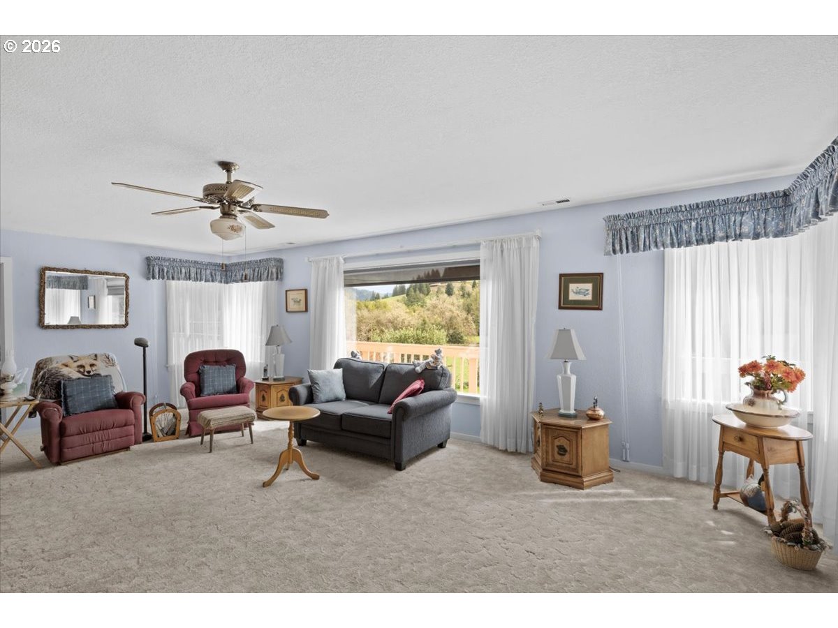 2277 Cougar Creek Road Oakland, OR 97462 - Photo 7 of 34 a living room with furniture and a window