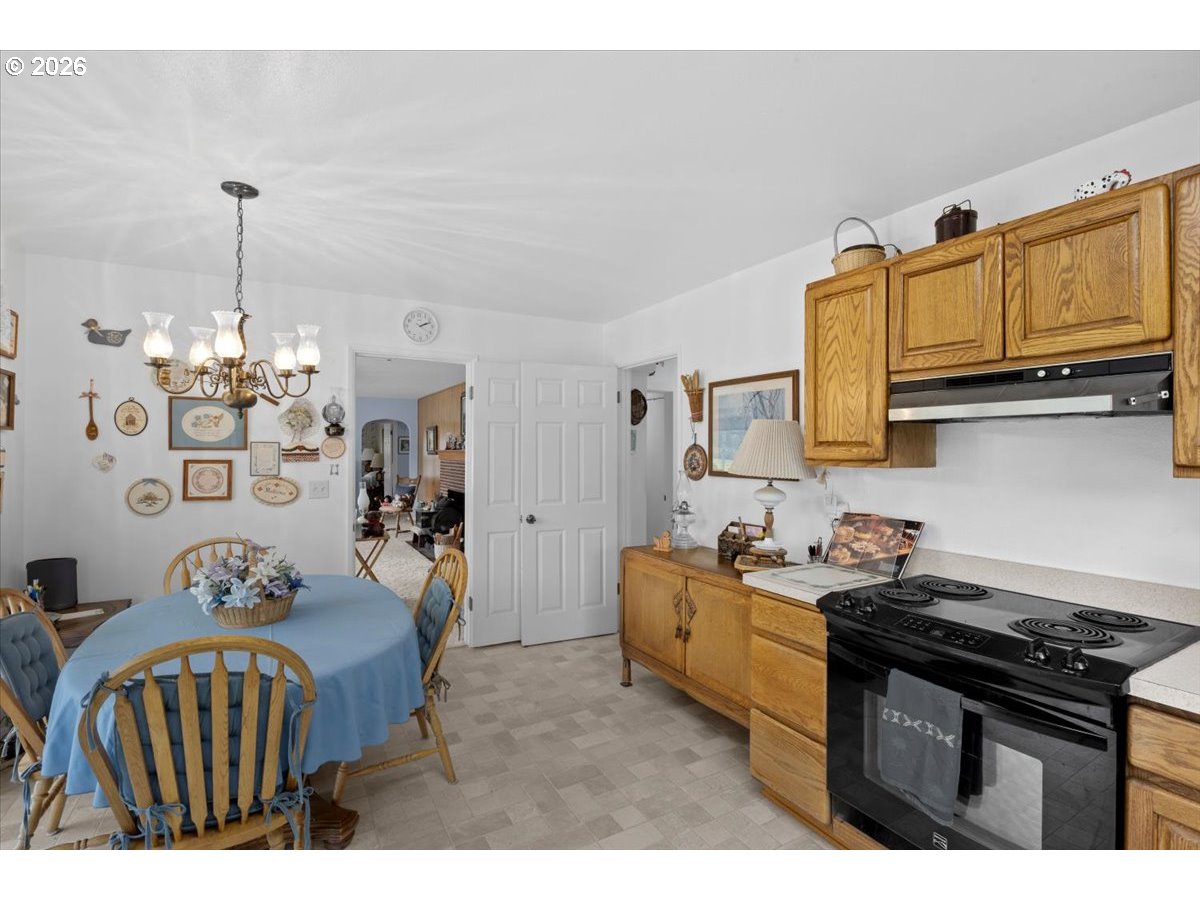 2277 Cougar Creek Road Oakland, OR 97462 - Photo 9 of 34 a kitchen with stainless steel appliances granite countertop a sink stove and cabinets