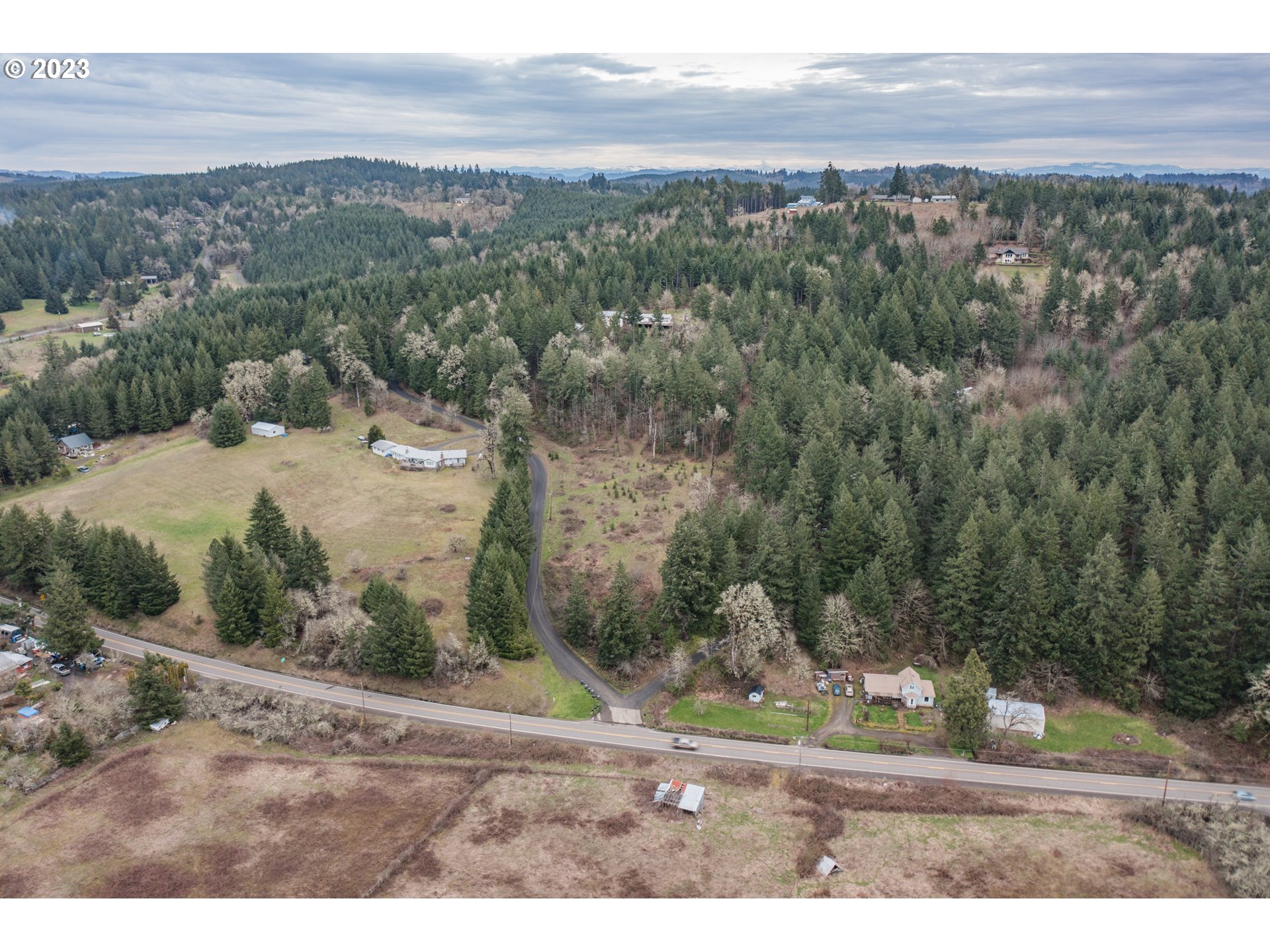 5891 Kings Ridge Road, Unit 1 Dallas, OR 97338 - Photo 4 of 48 a view of a yard with mountain