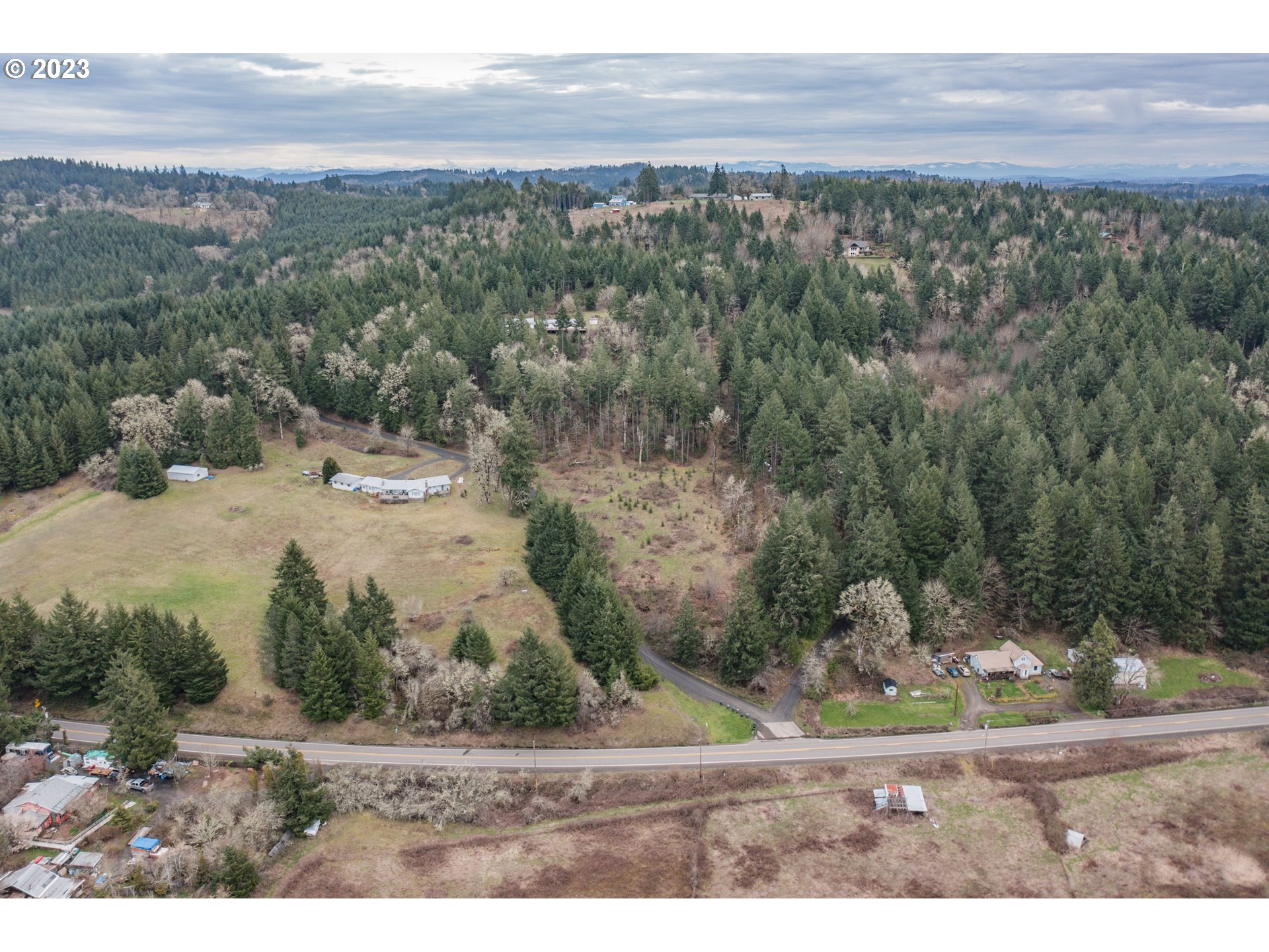 5891 Kings Ridge Road, Unit 1 Dallas, OR 97338 - Photo 5 of 48 a view of a yard with an outdoor space