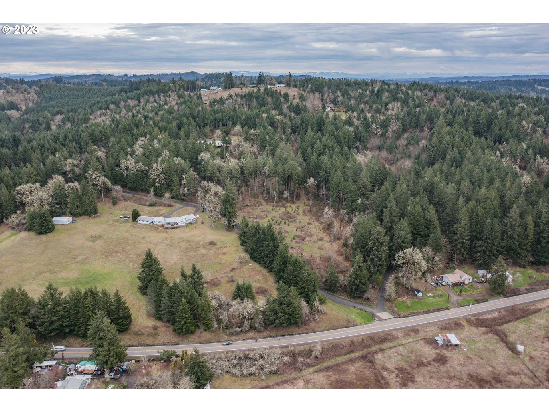 5891 Kings Ridge Road, Unit 1 Dallas, OR 97338 - Photo 6 of 48 a view of a yard with wooden fence