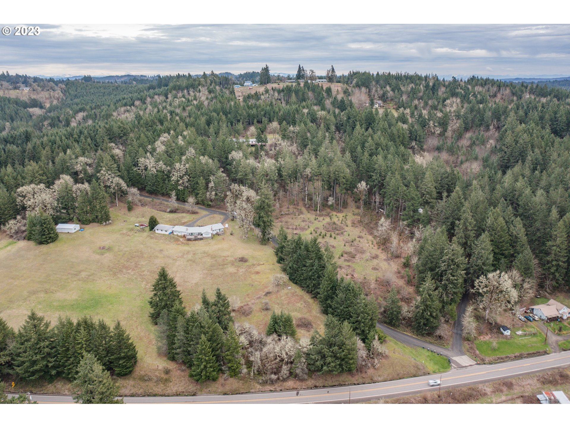 5891 Kings Ridge Road, Unit 1 Dallas, OR 97338 - Photo 8 of 48 a view of a road with an outdoor space