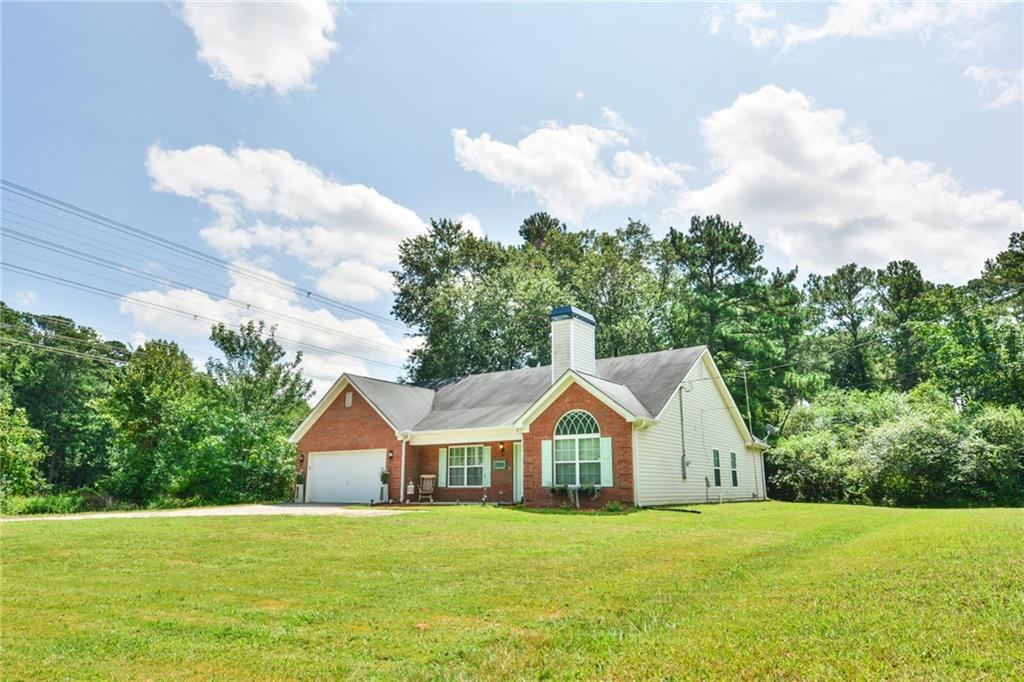 877 McDonough Road Hampton, GA 30228 - Photo 1 of 1 This wonderful 4 bedroom 3 bath home sits back on over 1 acre of land for peaceful living. Level yard - sides and back allows for RV or boat parking.