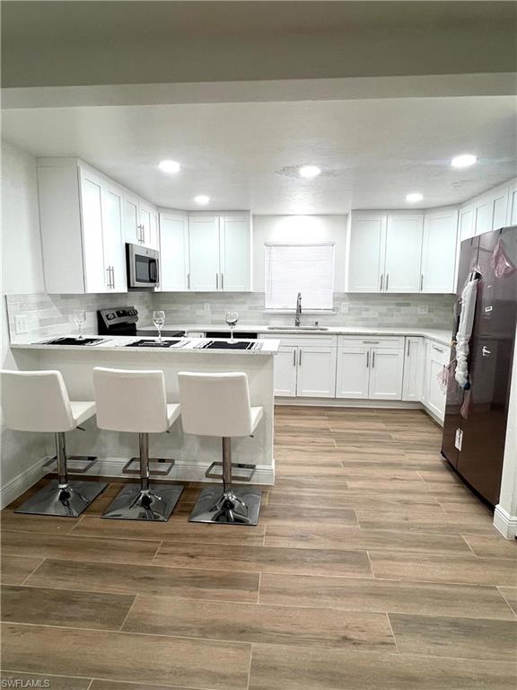 8430 Wren Road Fort Myers, FL 33967 - Photo 10 of 50 New wood cabinets, granite tops, and new stainless steel appliances.