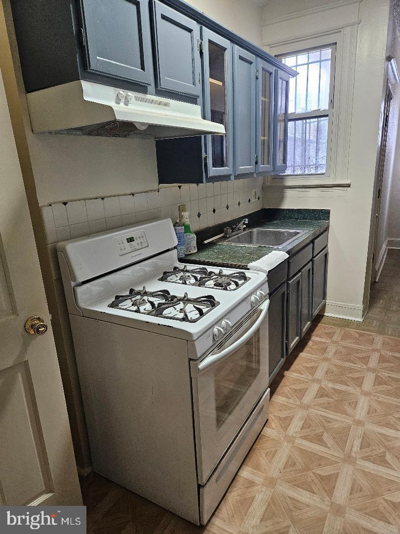 825 Delafield Place Northwest Washington, DC 20011 - Photo 18 of 25 a white stove top oven sitting inside of a kitchen