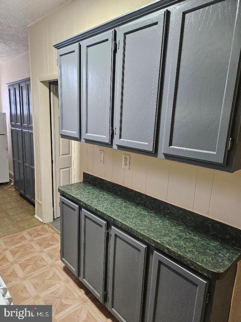 825 Delafield Place Northwest Washington, DC 20011 - Photo 20 of 25 a kitchen with granite countertop a sink and a refrigerator