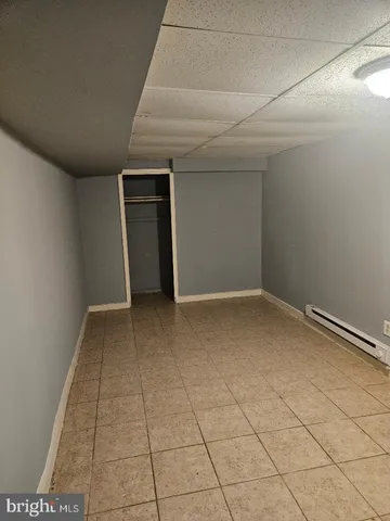 an empty room with a bench