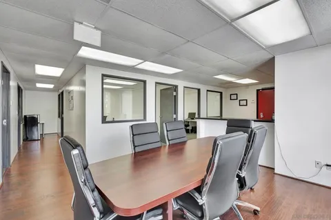 a view of room with window and furniture