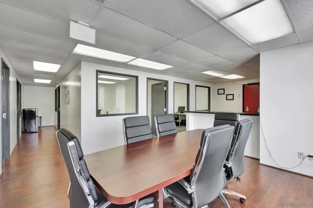 a view of room with window and furniture