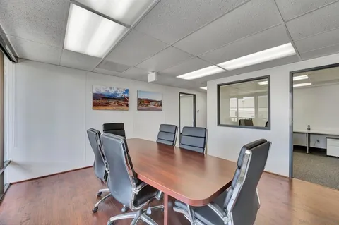 a view of a workspace with furniture