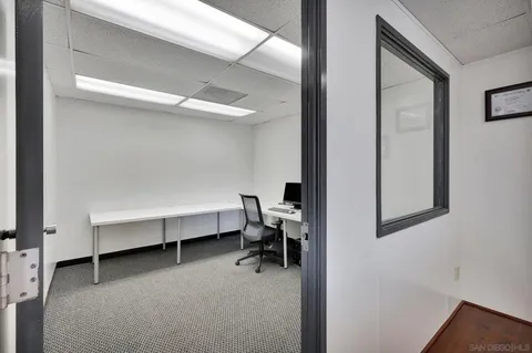 a workspace with a desk and chair