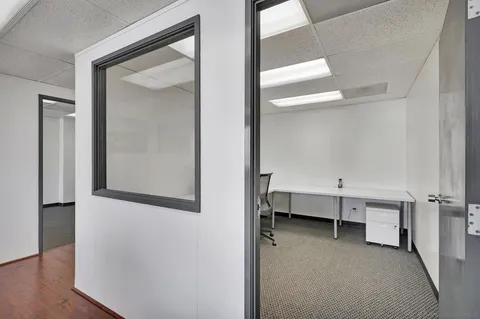 a view of a workspace with furniture