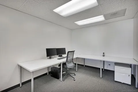 a kitchen with a refrigerator and a sink