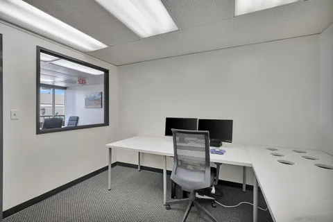 a view of a livingroom with furniture and a flat screen tv