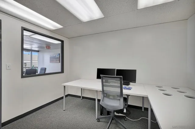 a view of a livingroom with furniture and a flat screen tv