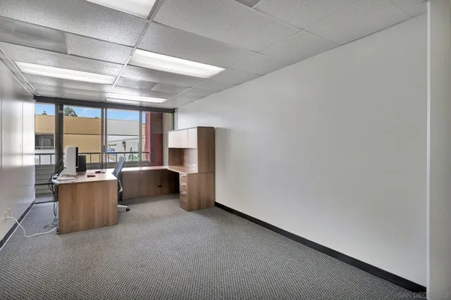 a view of a kitchen from the hallway