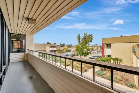 a view of a living room with wooden floor